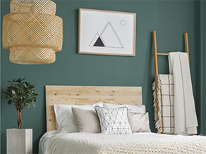Dark Green Painted Bedroom Wall with Wooden Rack and Art Frame